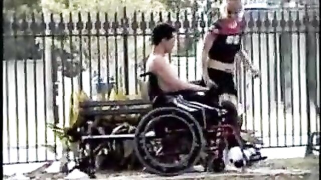  Disabled and carer pee in park