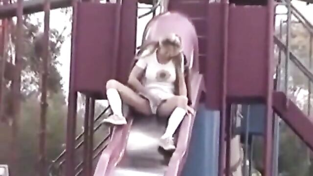 xhamstercom_9076945_hot_blonde_with_large_pussy_lips_upskirt_peeing_over_a_slide_480p