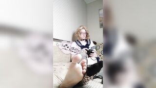 Sexy cute gamer sissy crossdresser in school uniform shows feet and ignoring you