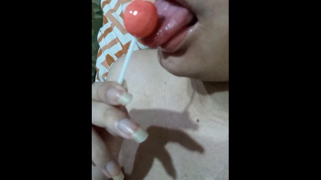 Femboy sucking a lollipop