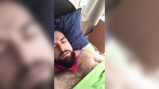 Big bearded and hairy bear wanking rubbing the bed sheet on his hard and wet cock. Beautiful Agony
