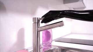 Maid polishes latex with soap