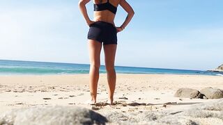Fitness couple undress on a public beach and masturbate with people watching