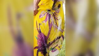 She Pissing in exotic nature with one leg up
