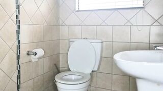 Chubby mature Blonde struggles to pee on toilet so she undresses and slaps her pussy