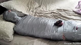 bearded dom using mummified boy as a toy