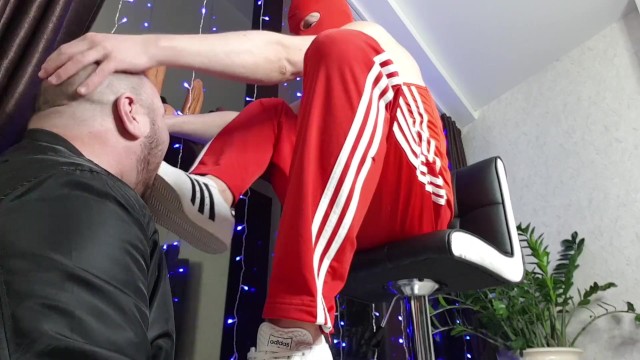 Dominant in Adidas dominates skinhead very hard -foot and sneakers fucks in the mouth and slaps feet