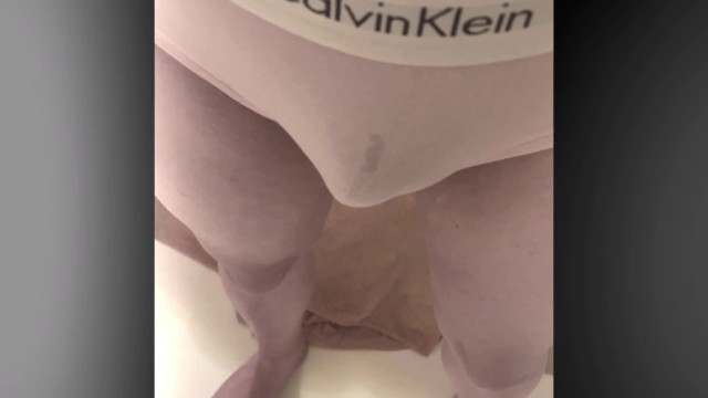 Peeing in pink panties.
