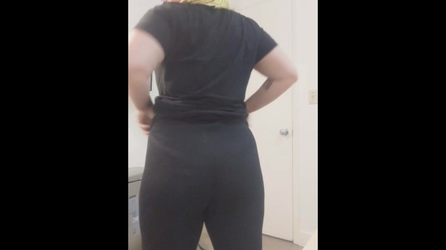 Fat ass trans guy wiggling into leggings.