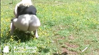Fat woman shitting in the field