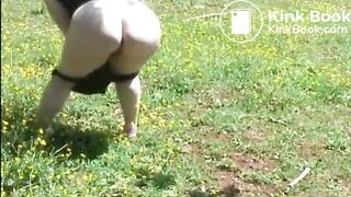 Fat woman shitting in the field