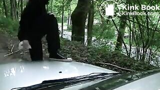 Girl liquid shitting on a white car hood