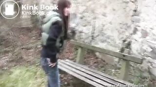 Girl shit and pissing on a bench by the stone wall - Pooping