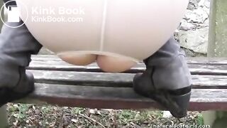 Girl shit and pissing on a bench by the stone wall - Pooping