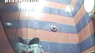 beautiful girl suffering from diarrhea in a public toilet