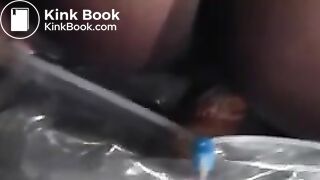 Black babe shitting in a bag outdoor