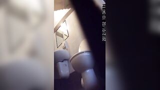 woman has diarrhea in a public toilet