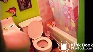 pretty blonde pooing a toilet