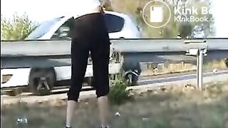 Woman shit near the road