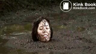 Girl rolling in pig shit pit