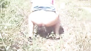 Latina girl pooping outdoor