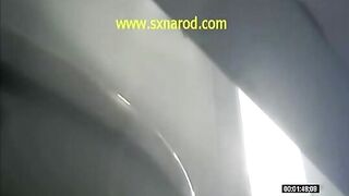 woman vomiting in public toilet