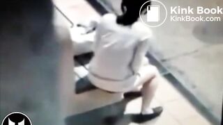 Woman Shitting At Bus Stop