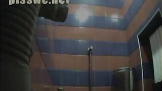 Lady has a stomach sick in a public toilet