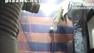 Lady has a stomach sick in a public toilet