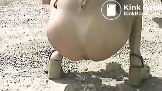 Brunette poops outdoor