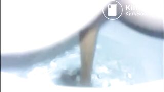 Girl shitting diarrhea in the toilet closeup
