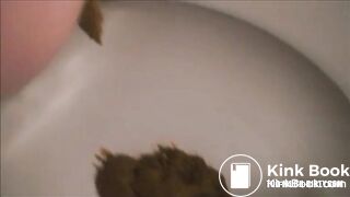 Fast shit in the toilet closeup