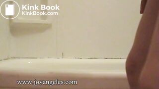 Mila Perlman  poops by side of bath