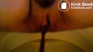 Girl shitting in the toilet and inserting dildo on her asshole