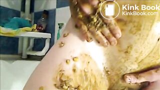 Woman is smearing shit on her breast