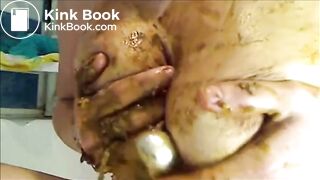 Woman is smearing shit on her breast