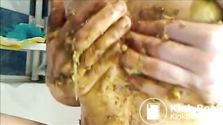 Woman is smearing shit on her breast