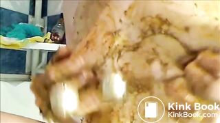 Woman is smearing shit on her breast