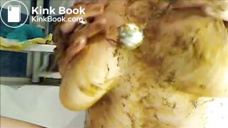 Woman is smearing shit on her breast