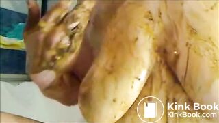 Woman is smearing shit on her breast