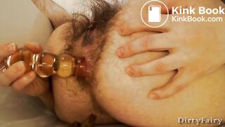 Hairy lady's shitty anal dildo play