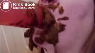 Dirty girl sucking and licking a shitty dildo