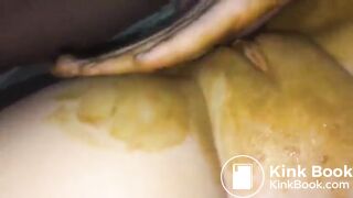 Smearing shit on her shaved pussy