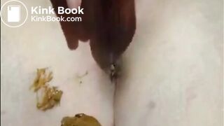 Shaved girl shitting closeup and fingering her pussy