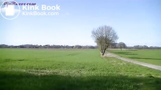 Mia pooping on the edge of a field