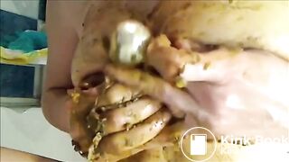 Mature woman smearing shit on her tits