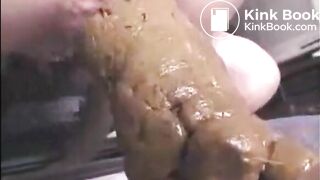 Girl shitting a very big turd closeup