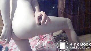 Indian lady drops hard poops into a glass