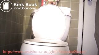 Veronica dropping giant logs into her toilet