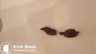 Brunette shitting in the bathtub